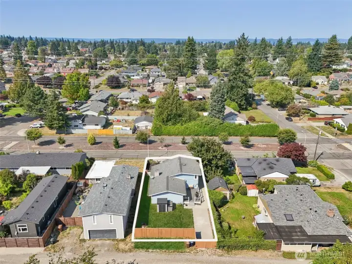 Aerial view of 4612 N 21st St, Tacoma, WA — highlighting the full property boundaries, fenced backyard, driveway access, and prime North Tacoma location. Surrounded by established neighborhoods, parks, schools, and local amenities, this home offers convenient access to commuting routes and the desirable lifestyle of the North End. No HOA!