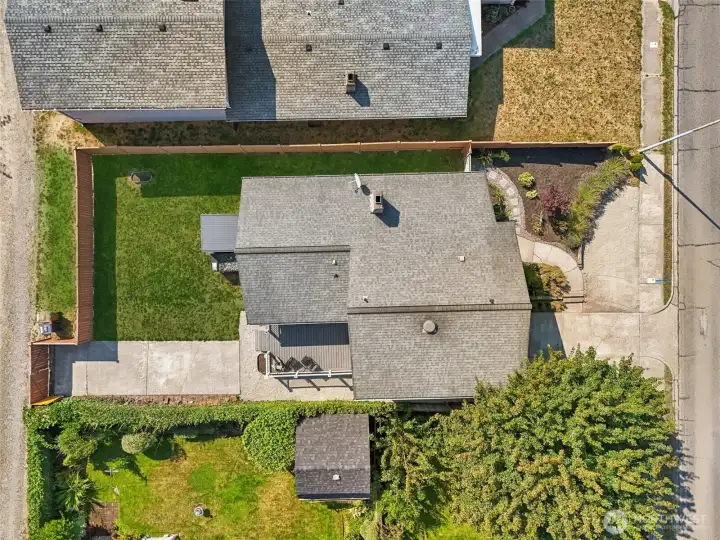 Top-down aerial view of 4612 N 21st St, Tacoma, WA — showcasing the full lot layout, fenced backyard, extended driveway, outdoor deck, and landscaped front entry. This North Tacoma property offers excellent outdoor space, privacy, and a well-maintained lot in a desirable, established neighborhood with no HOA!