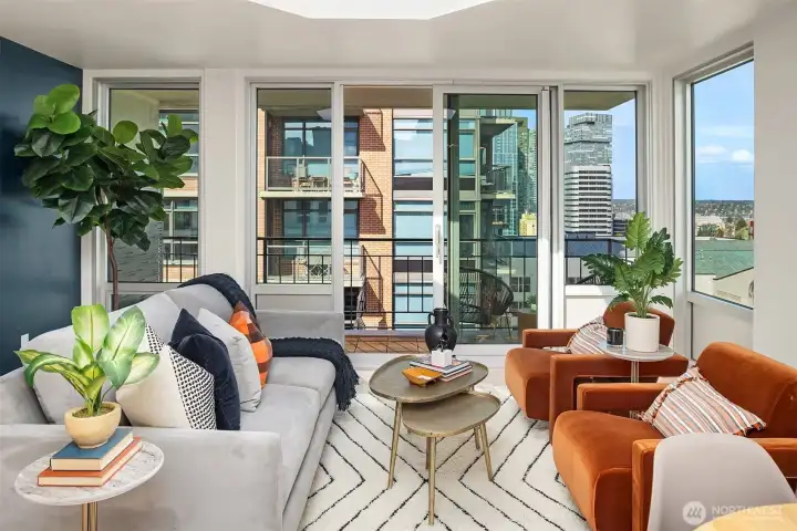 Sliding glass doors from living room to large patio with room for gardening and lounging