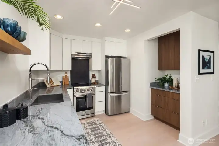 Beautiful new quartz counters and new cabinets. Tons of functionality in this redesigned kitchen, it lives large!