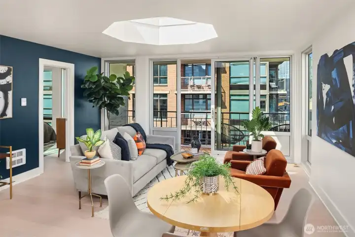 Dining area adjacent to kitchen with floor-to-ceiling east-facing window