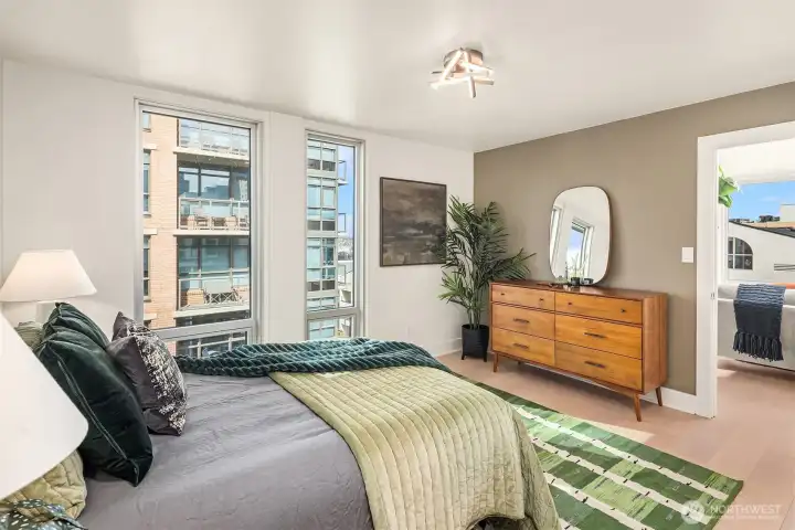 Primary bedroom boasts views, all new paint, flooring, and lighting