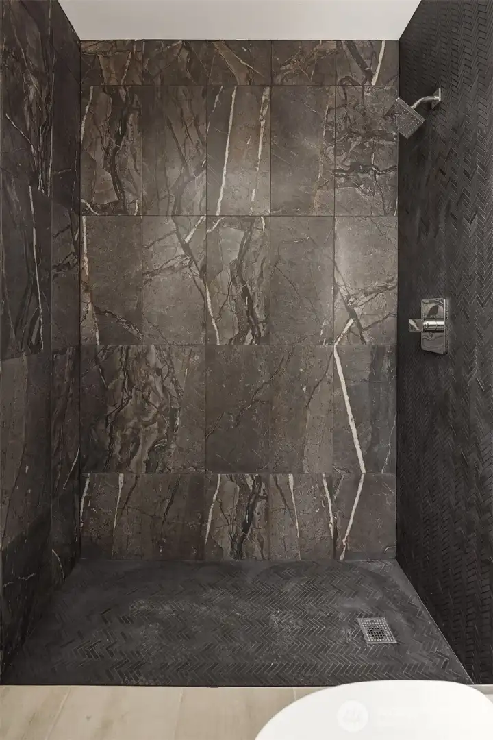 Large shower in ensuite bath will have new glass door installed by seller before closing - shower glass now installed