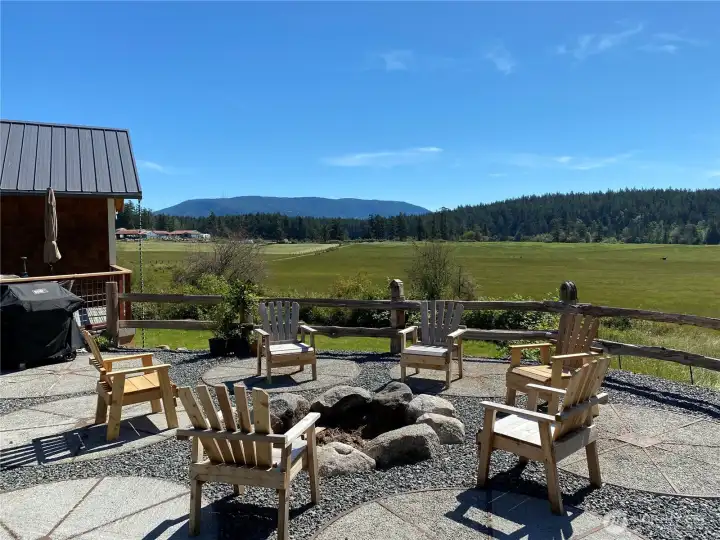 Large patio with fire pit is used year-round.