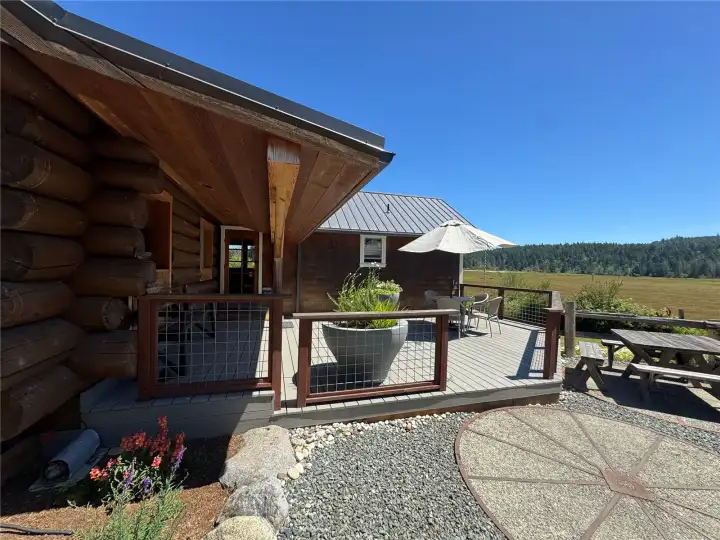 Covered porch welcomes you and offers a space to welcome the day watching the sun come up- rain or shine. Covered porch welcomes you and offers a space to welcome the day watching the sun come up- rain or shine.