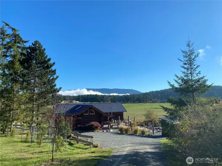 Mid-day sunlight fills the valley and showcases Mount Constitution as  backdrop.