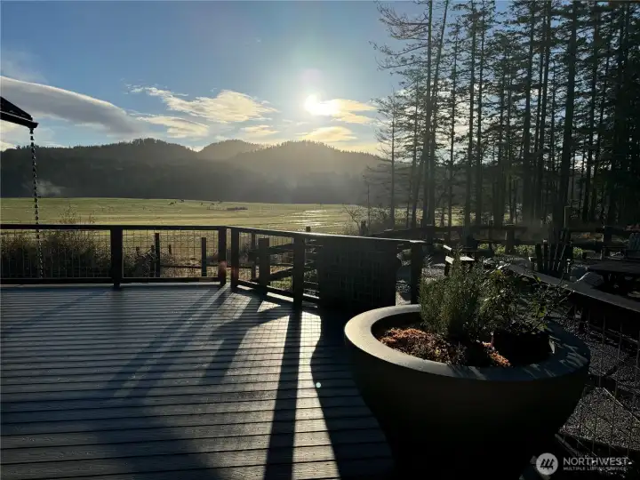 Sunrise looking from front deck to the southeast. Sunset Mountain peaks high above the valley.