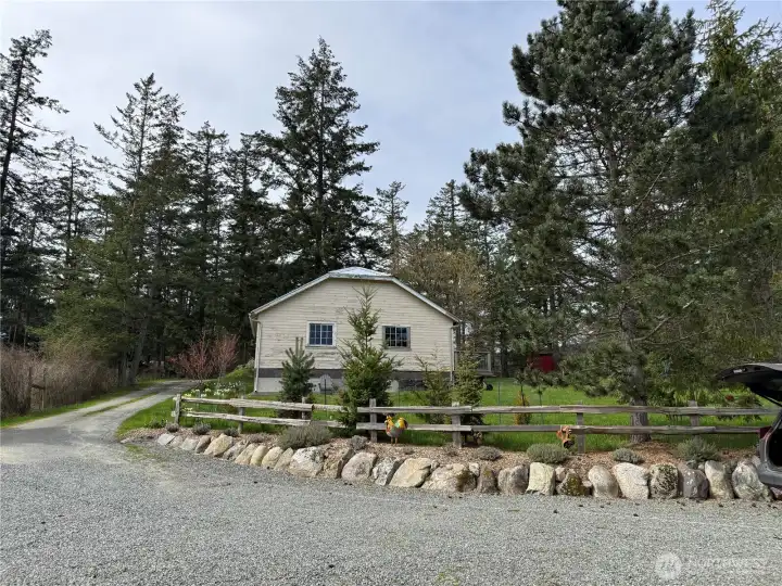 Large storage building sits at the top of the driveway. Flowering plum trees and daffodils welcome you home in the spring. Large storage building sits at the top of the driveway. Flowering plum trees and daffodils welcome you home in the spring.