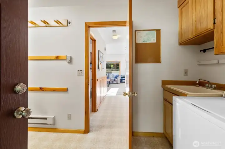 View from the mudroom/laundry areas highlighting smart storage and flow.