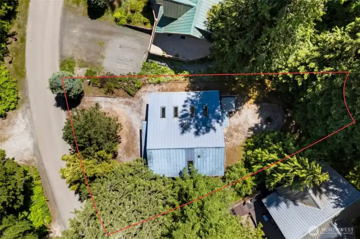 Overhead view showing the secluded lot and natural buffer.