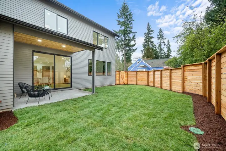 Generous fenced backyard off living area.  Covered patio with gas hookup for outdoor cooking.