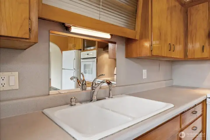 Original cast iron sink and cabinets.