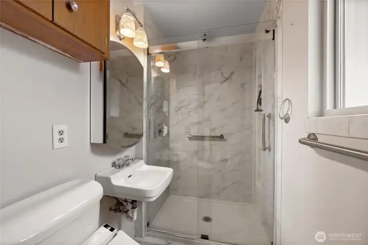 Updated 3/4 bath off of the primary bedroom with walk in shower.