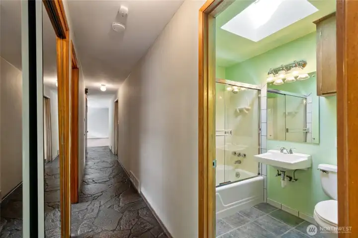 Full bath on main floor. Look at these AMAZING  slate floors.