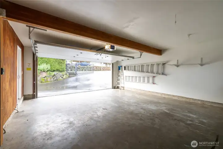 This is the 2 car garage for the main floor unit. Notice ahead the electric gate.