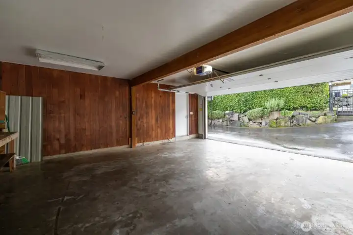 The main floor 2 car garage has a door leading to the covered porch so you can stay dry during rainy days!