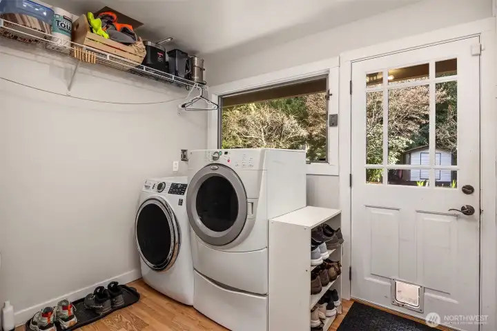 The laundry/mud room is a great drop zone area with access door to the yard.