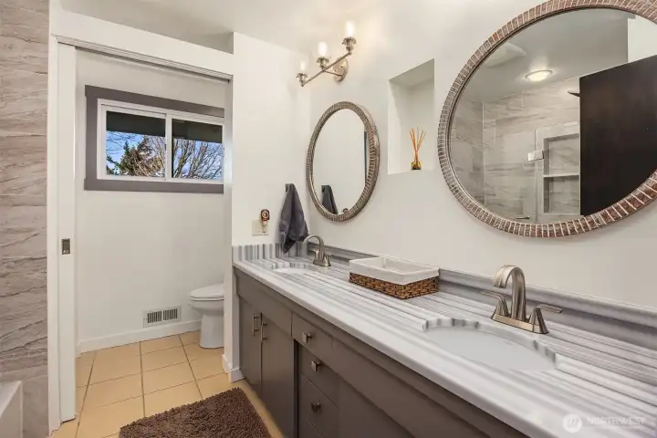 Well-dressed full bath serves the upper-level bedrooms nicely.