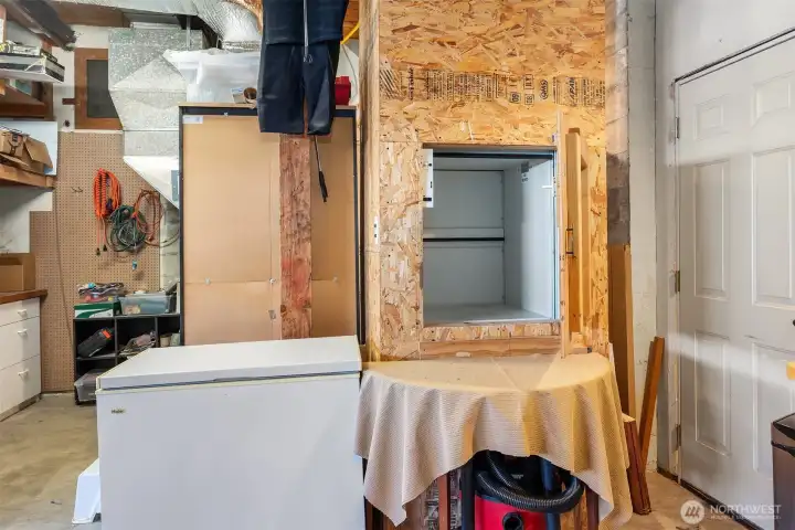 Convenient dumb waiter from garage to kitchen will come in handy to transport groceries, heavy beverages and household supplies.