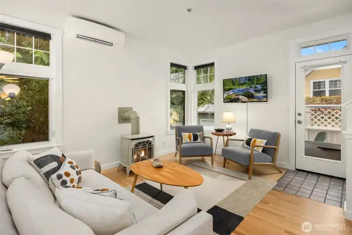 The main room flows out to a sunny deck on the same level.