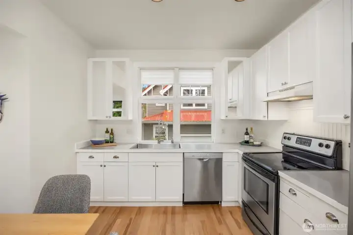 A new, larger stainless steel sink and garbage disposal make meal cleanup easy.