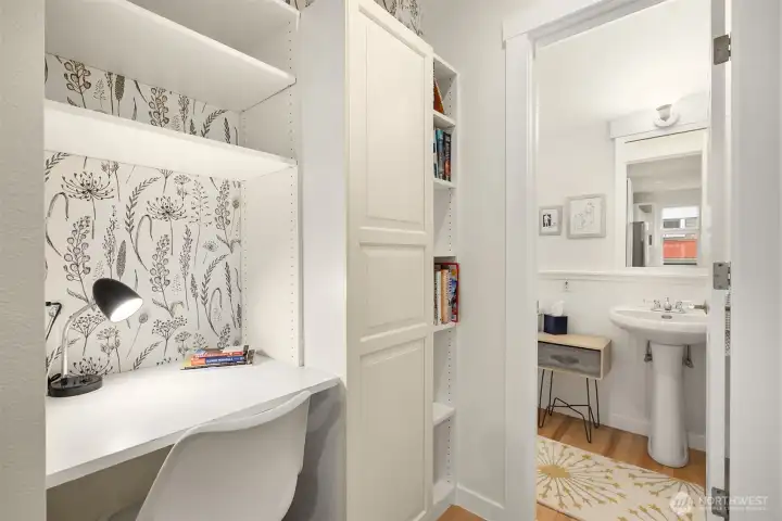 A built-in desk provides a convenient space for remote work or study.