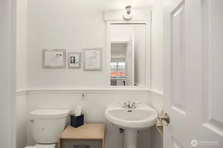The well-appointed powder room on the main level is tucked into its own private corner.