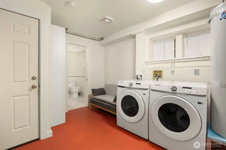 The lower level, connected to the one-car garage, accommodates the laundry area, water heater, seating area, large storage space and a shower bath.