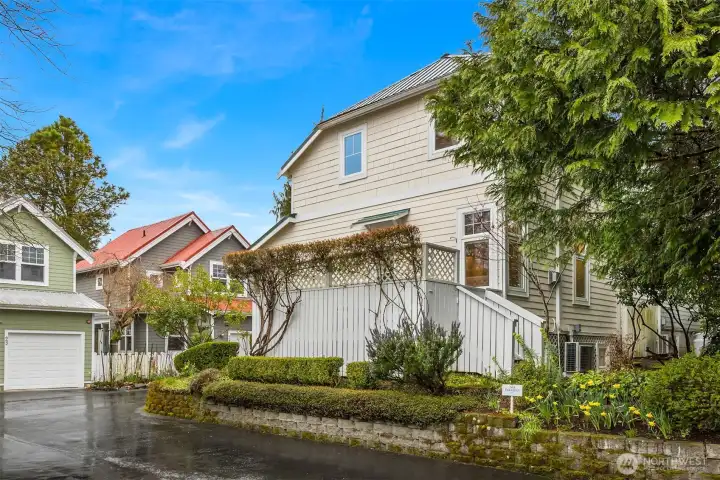 Lush flowering vines enhance the appeal of the private deck.