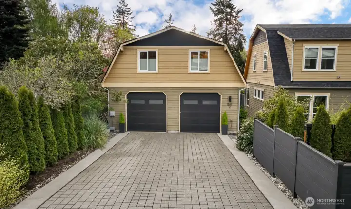Parking area, attached garage on the left with access to home. 1 parking spot in driveway.