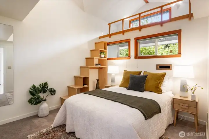 On the other side of the house is a whimsical bedroom with extra loft space.
