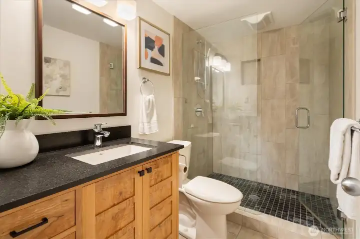 The updated 3/4 bathroom just down the hall.