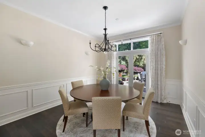 Dining room with custom made dining table. Dining table and chairs convey with the house. Dining room with custom made dining table. Dining table and chairs convey with the house.