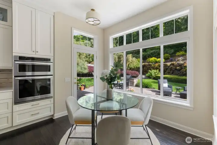 Dining area off of the kitchen with garden views. Dining area off of the kitchen with garden views.