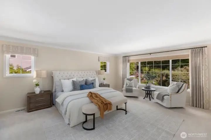 Primary bedroom with large sitting area and a view of the beautifully landscaped backyard. Primary bedroom with large sitting area and a view of the beautifully landscaped backyard.