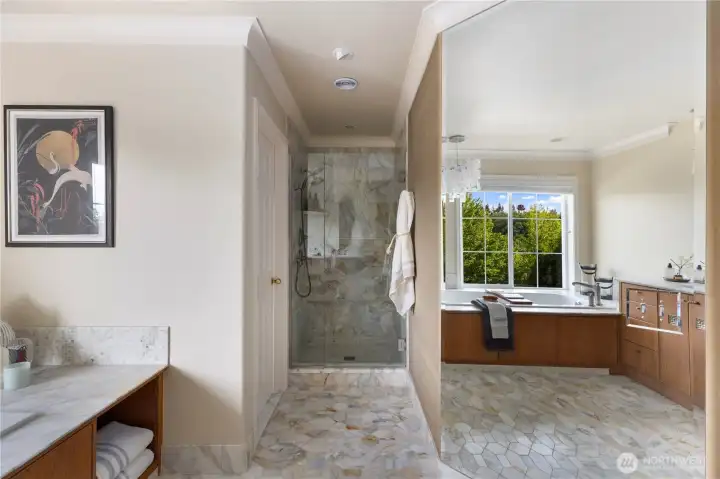 Full length mirror in primary bathroom reflects the stunning marble tile floor. Full length mirror in primary bathroom reflects the stunning marble tile floor.