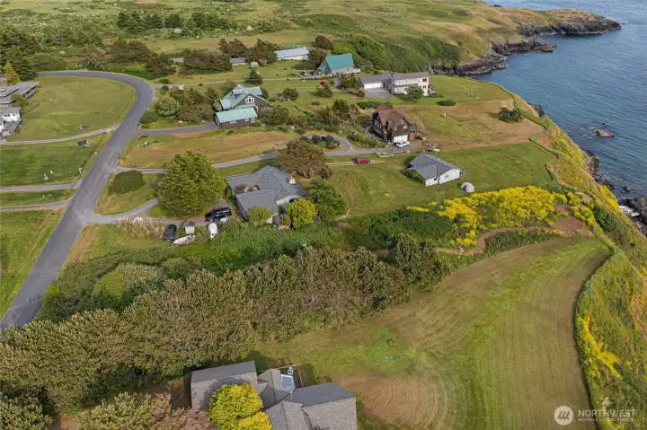 Elevated perspective showcases the property’s level building area, coastal setting, and desirable location near Eagle Cove on San Juan Island.