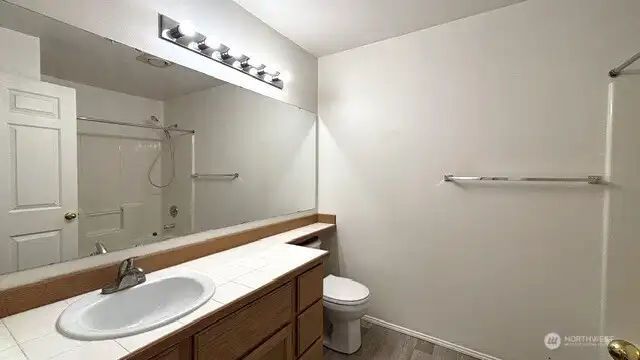 Bathroom-new sink, toilet, and flooring