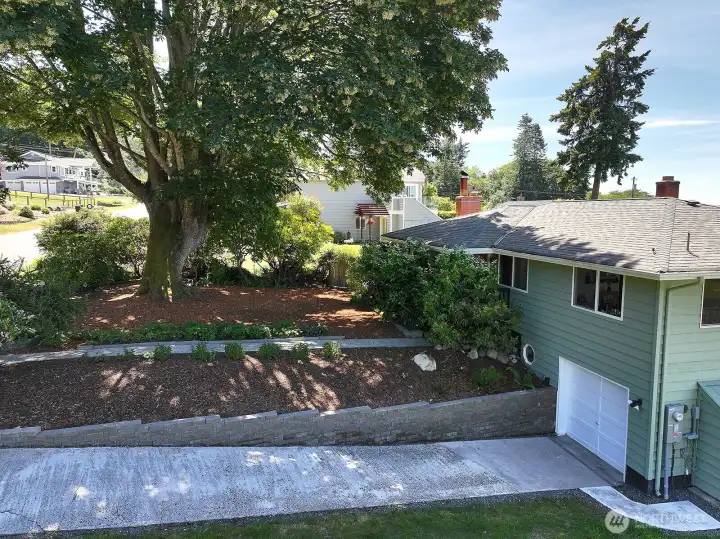 A view from the north of the front of the home and garage.