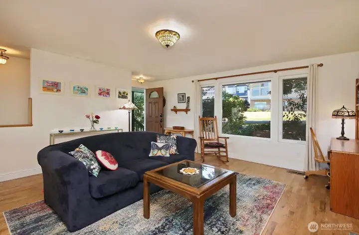 Living room view. Fireplace to the right of this photo and the photographer's back is to the dining area.