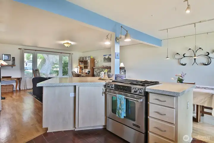 Open floor concept creates ease for entertaining. Kitchen has a gas stove and granite countertops.