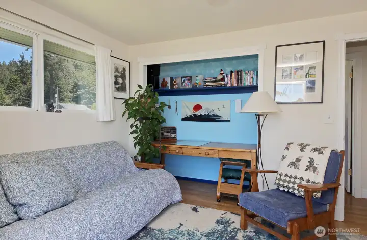 The french doors and water view are to the photographer's back in this photo.