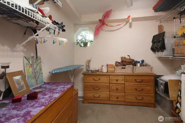 Here is another room on the lower level used as a large walk in closet.