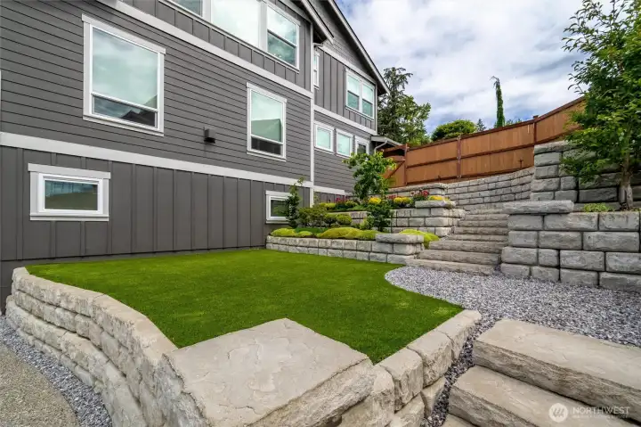 Hard-scapes features easy care turf Hard-scapes features easy care turf