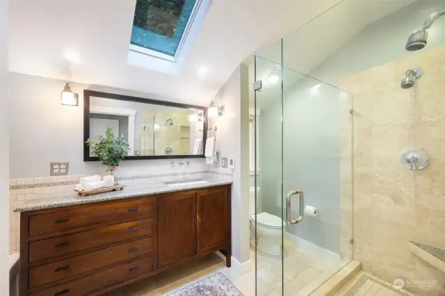 Primary en suite with shower, soaking tub and heated floors.