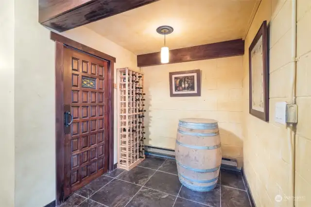 Tuscan themed wine cellar on lower level.