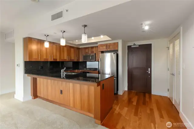 Gleaming wood floors in entry. Open, inviting floor-plan.