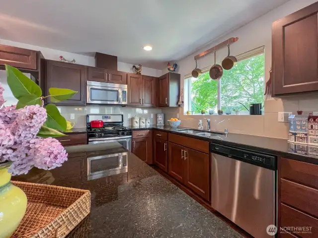 Large window over sink lets in tons of light and a lovely view.