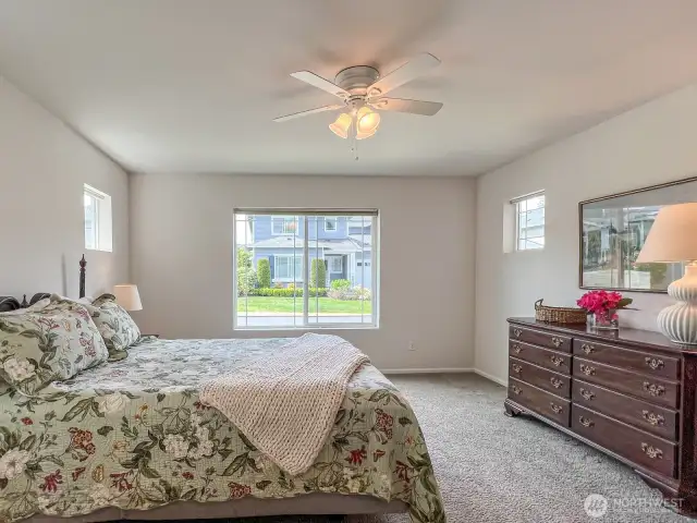 Also on the main floor, you'll find a spacious, bright primary suite!