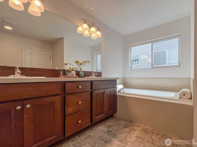 Meticulously maintained cherry cabinetry, a soaking tub, and new, upgraded lighting.